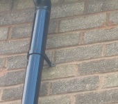 Replacement downpipe secured and fixed to the wall by P & AS Hayselden Roofing Barnsley